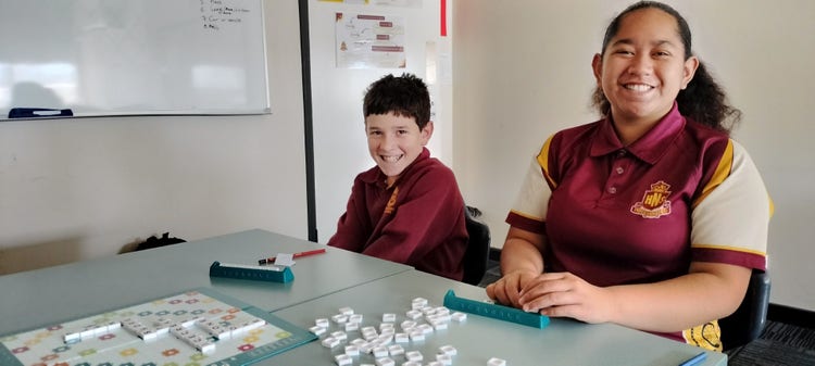 students playing a game of scrabble