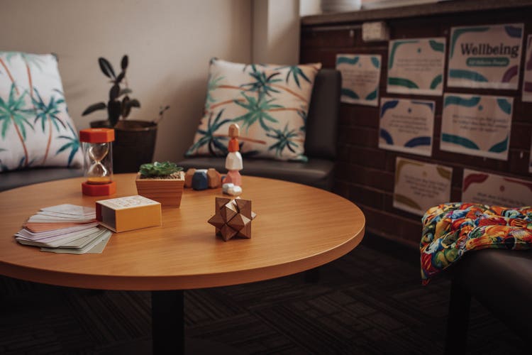 Table and Chairs in Wellbeing room with toys on table